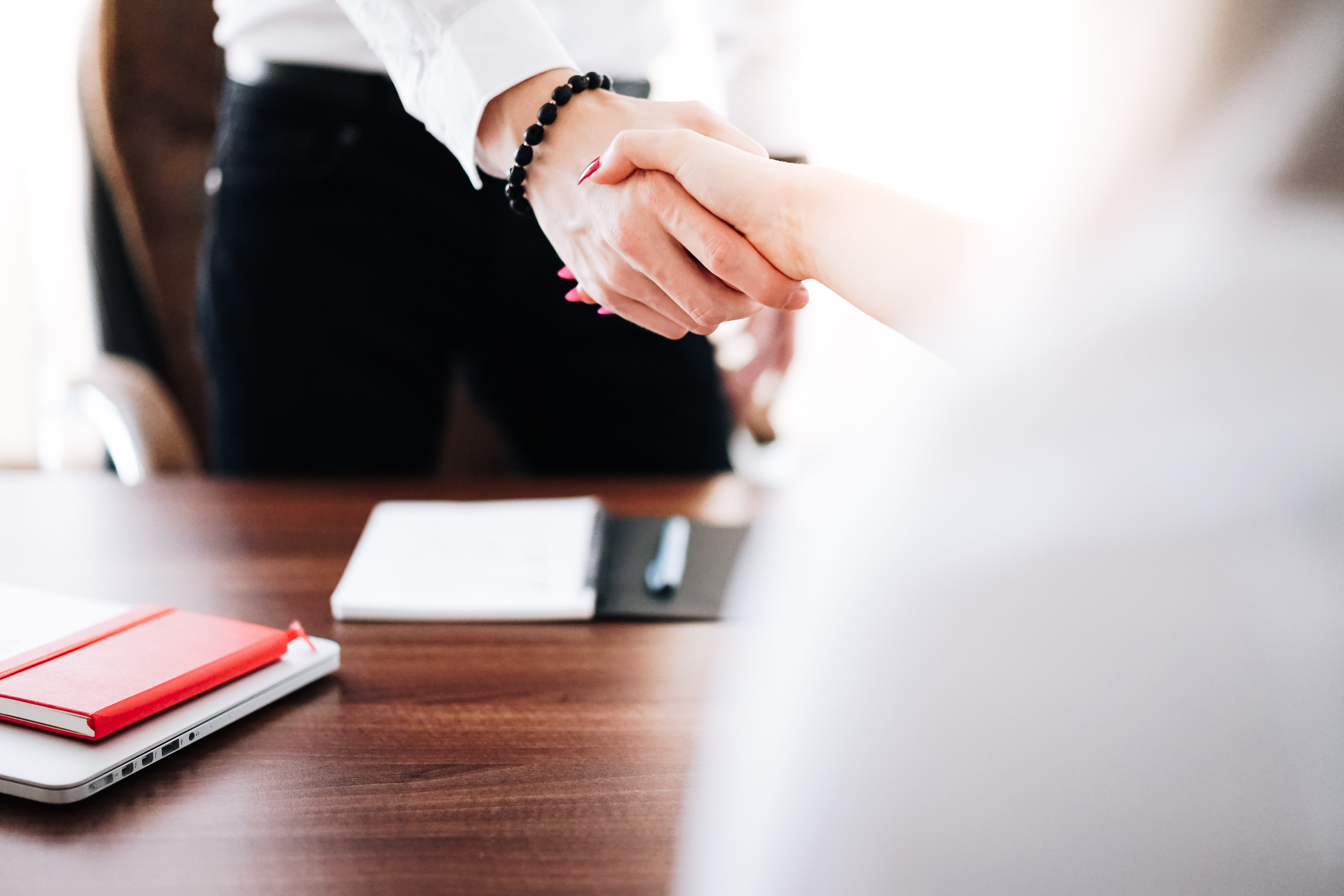 business-man-and-woman-handshake-in-work-office-picjumbo-com